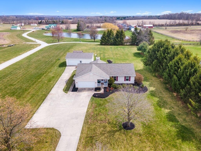 drone / aerial view with a rural view and a water view