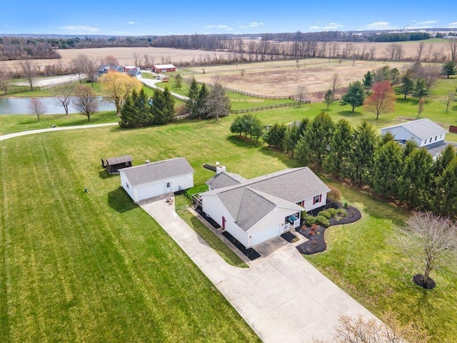 drone / aerial view featuring a rural view and a water view