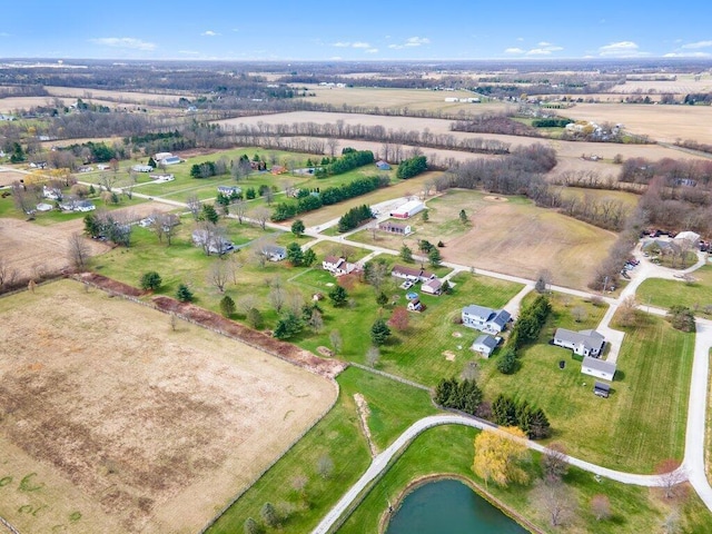 drone / aerial view with a rural view and a water view