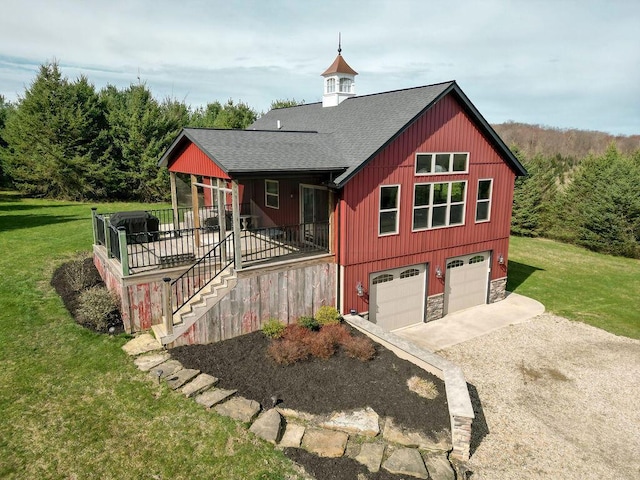 view of front of house with a garage and a front lawn