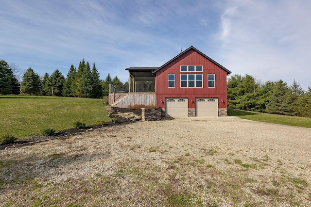 view of home's exterior with a yard and a garage