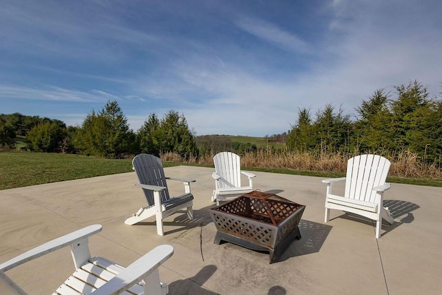 view of patio / terrace featuring an outdoor fire pit