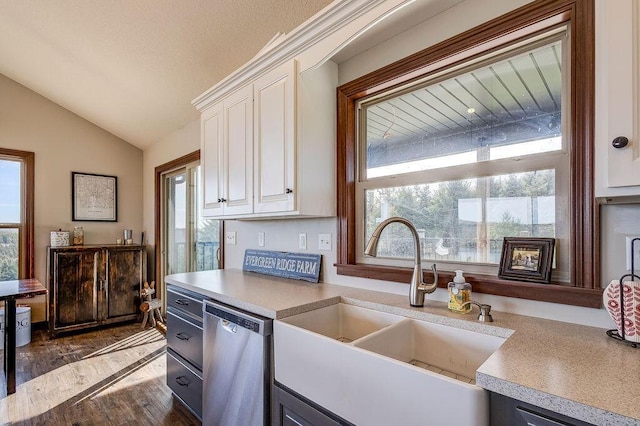 kitchen featuring sink, dishwasher, white cabinets, dark hardwood / wood-style floors, and lofted ceiling