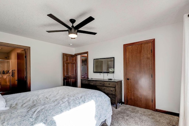 carpeted bedroom with ceiling fan and a textured ceiling