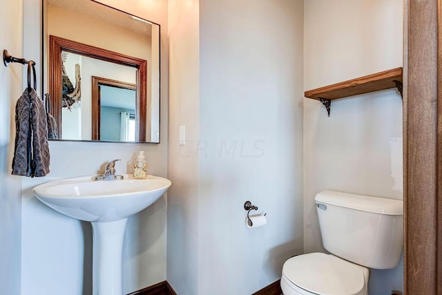 bathroom with sink and toilet