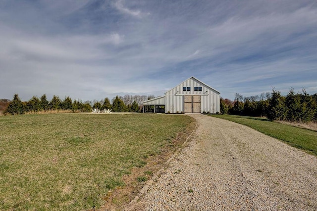 view of outbuilding with a lawn