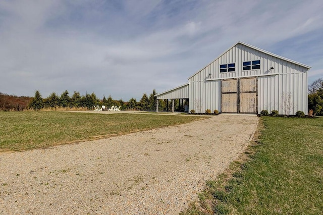 view of outdoor structure with a yard