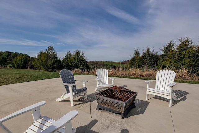 view of patio / terrace with an outdoor fire pit