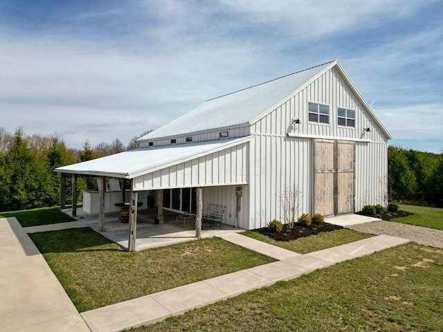 view of side of home featuring a yard