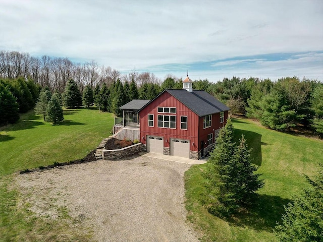 view of home's exterior with a lawn and a garage