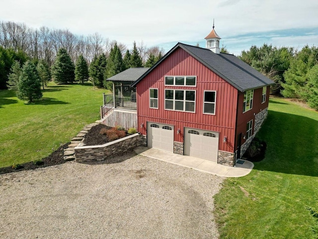 exterior space featuring a lawn and a garage