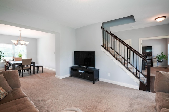 carpeted living room with an inviting chandelier