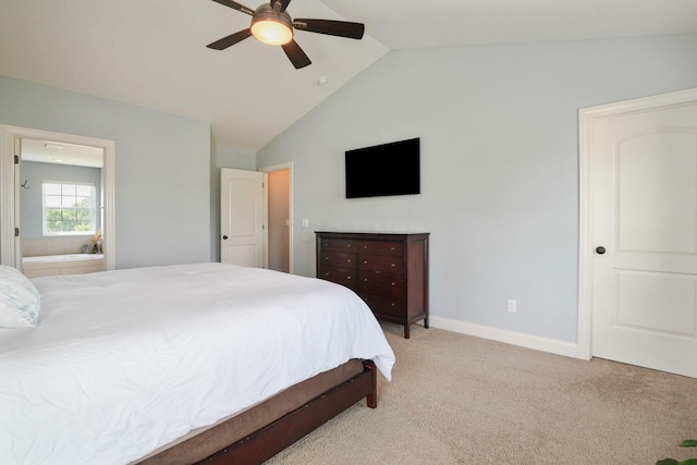 carpeted bedroom featuring ceiling fan, connected bathroom, and vaulted ceiling