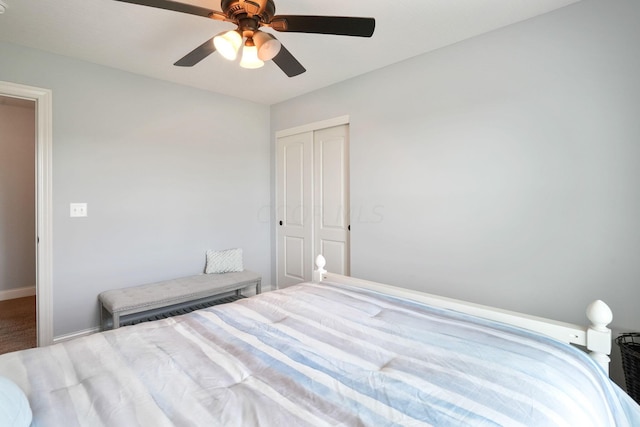 unfurnished bedroom featuring ceiling fan, carpet, and a closet