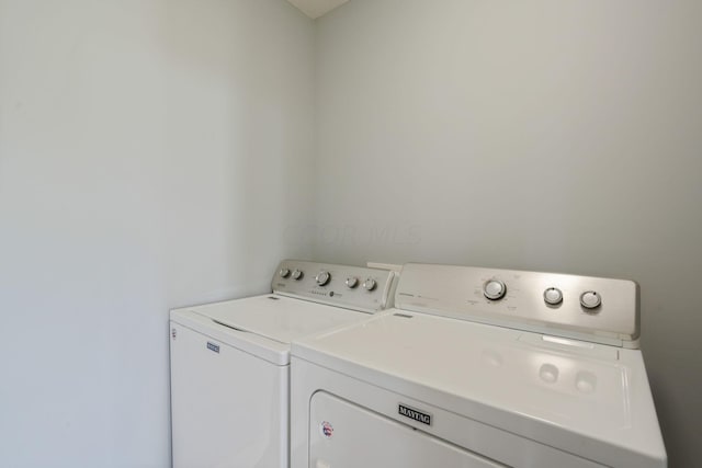 washroom with washer and clothes dryer