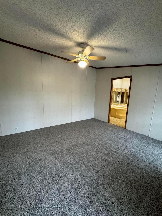 unfurnished room featuring a textured ceiling, carpet floors, ceiling fan, and ornamental molding