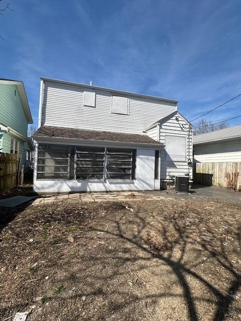 rear view of house with central air condition unit