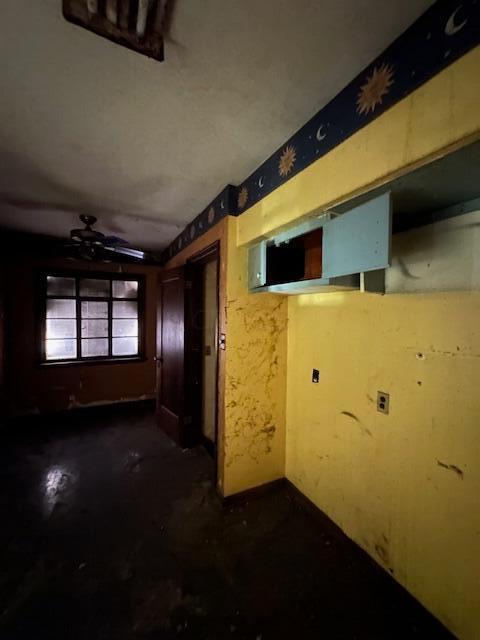 interior space featuring ceiling fan