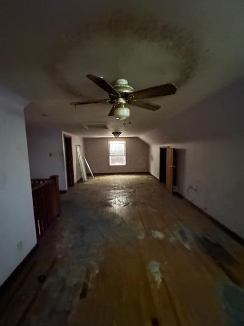 bonus room featuring hardwood / wood-style floors, ceiling fan, and lofted ceiling