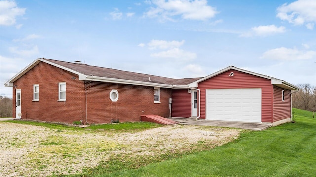 ranch-style house with a garage and a front lawn