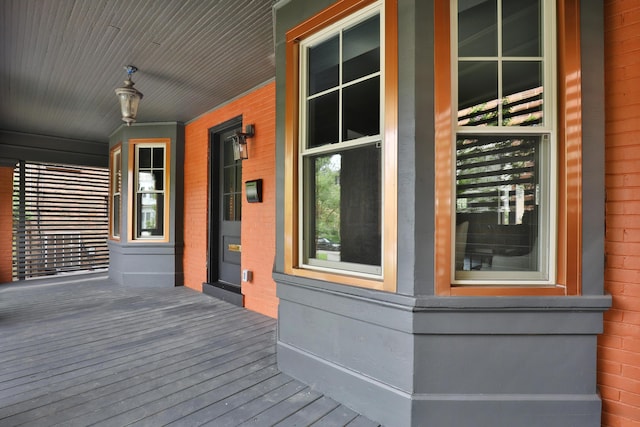 wooden terrace featuring covered porch