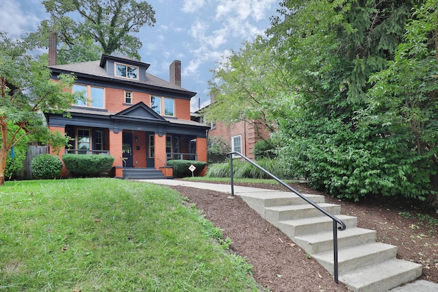 view of front of property featuring a porch and a front yard