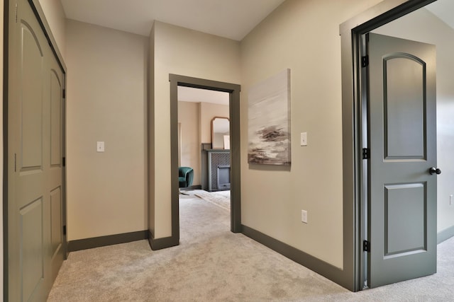 hallway with light carpet