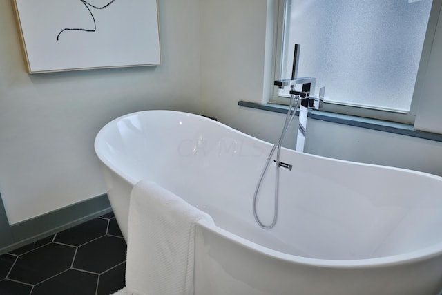 bathroom featuring a bathing tub and tile patterned floors