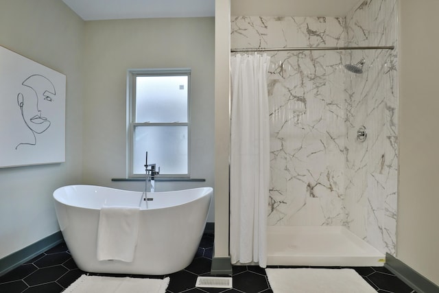 bathroom with tile patterned flooring and plus walk in shower