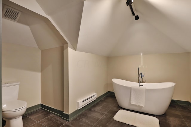 bathroom featuring a bath, lofted ceiling, toilet, and a baseboard heating unit