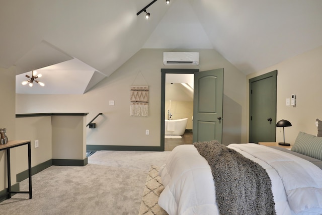 bedroom featuring light carpet, ensuite bathroom, a wall mounted AC, a chandelier, and lofted ceiling