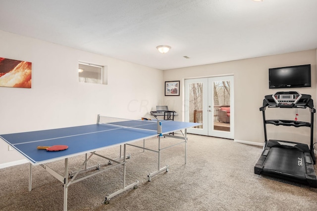 rec room featuring french doors and carpet floors