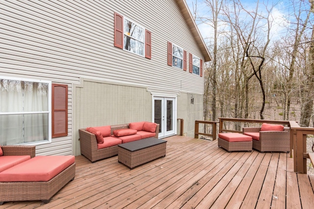 wooden terrace with french doors and an outdoor hangout area