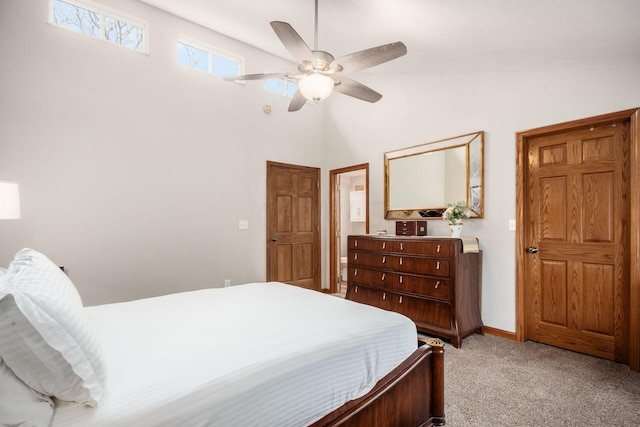 bedroom with ceiling fan, light carpet, and lofted ceiling