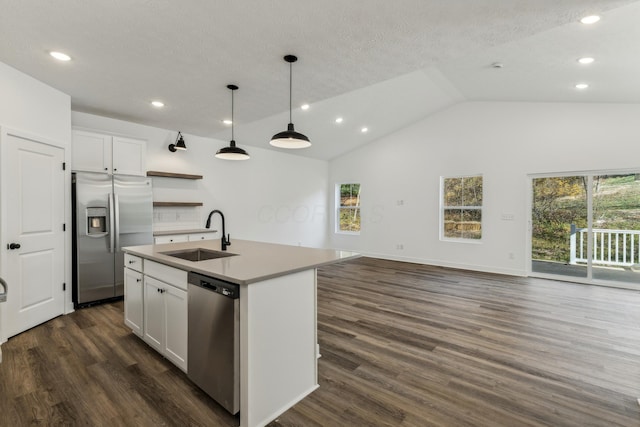 kitchen featuring sink, dark hardwood / wood-style flooring, an island with sink, white cabinets, and appliances with stainless steel finishes