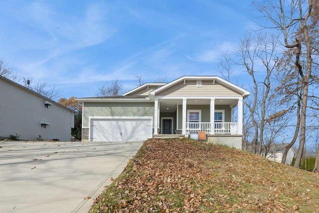 view of front of home featuring covered porch and a garage