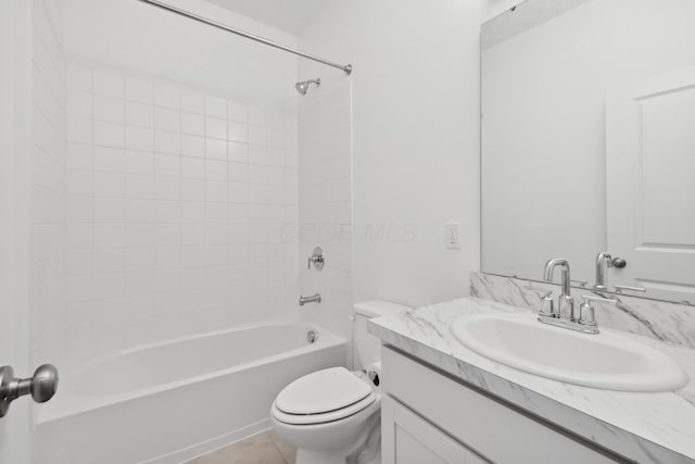 full bathroom with tile patterned floors, vanity, toilet, and tiled shower / bath combo