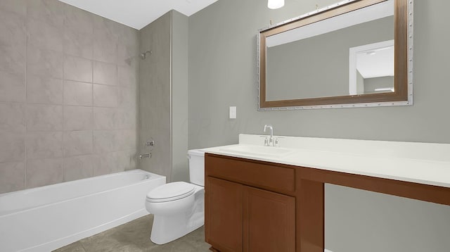 full bathroom featuring tile patterned flooring, vanity, toilet, and tiled shower / bath