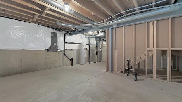 basement with heating unit, electric panel, and water heater