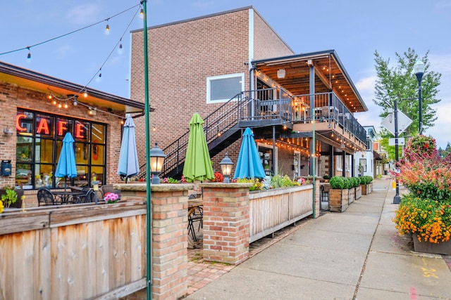 back of house featuring a wooden deck