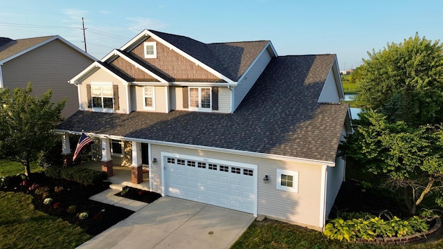 craftsman-style home featuring a porch and a garage