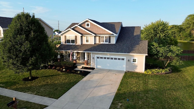 view of front of property with a front lawn and a garage