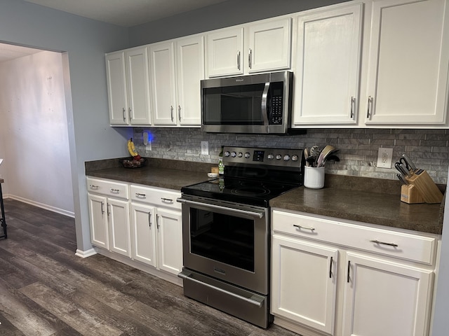 kitchen featuring white cabinets, dark hardwood / wood-style flooring, and stainless steel appliances