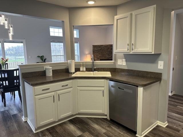 kitchen with dishwasher, dark hardwood / wood-style flooring, white cabinets, and sink