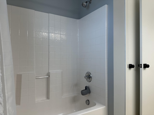 bathroom with shower / tub combo with curtain