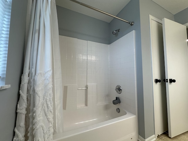 bathroom with shower / bath combo