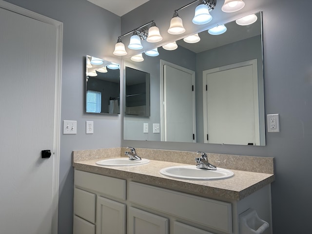 bathroom with a shower with curtain and vanity