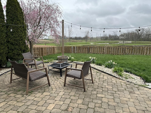 view of patio with an outdoor fire pit