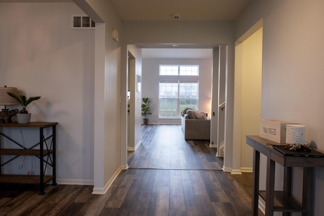 corridor with dark hardwood / wood-style floors