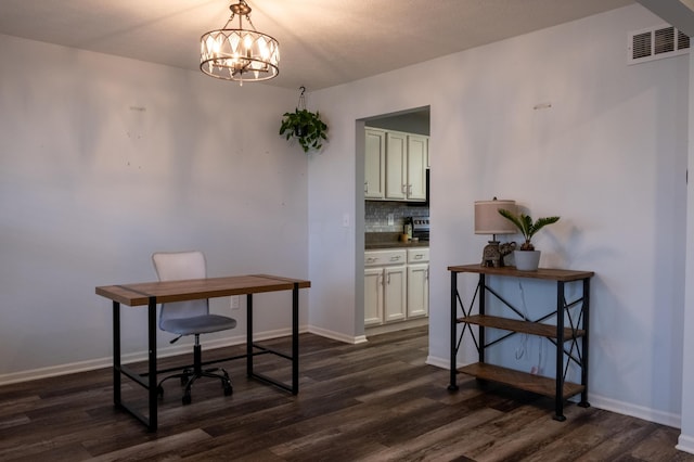 office with an inviting chandelier and dark wood-type flooring